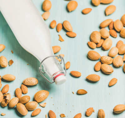 Dairy alternative almond milk in bottle, allergy-friendly food concept